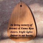 Engraved wooden wind sail on a personalized memorial wind chime for pets